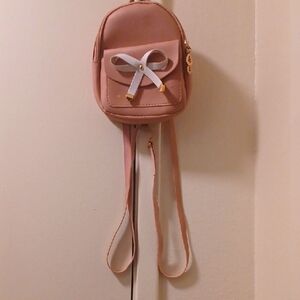 Elegant Pink Backpack with Bow Detail